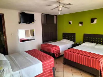 Cama o camas de una habitación en Hotel Real Santa María