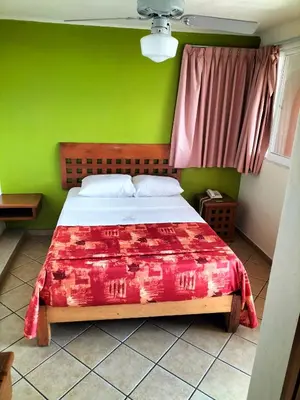 Cama o camas de una habitación en Hotel Real Santa María