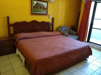 Cama o camas de una habitación en Hotel Real Jojutla