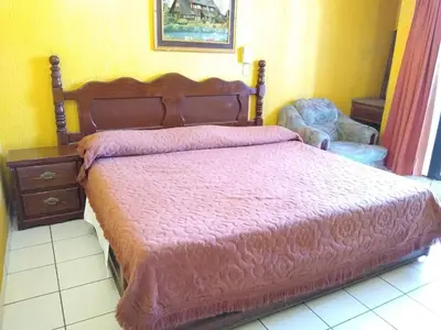 Cama o camas de una habitación en Hotel Real Jojutla
