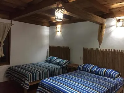 Cama o camas de una habitación en Cabañas La Isla Chacahua