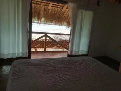 Cama o camas de una habitación en Cabañas La Isla Chacahua