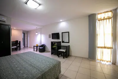 Una televisión o centro de entretenimiento en Hotel RS Suites