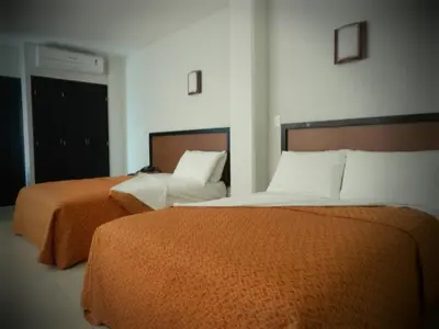 Cama o camas de una habitación en Hotel RS Suites