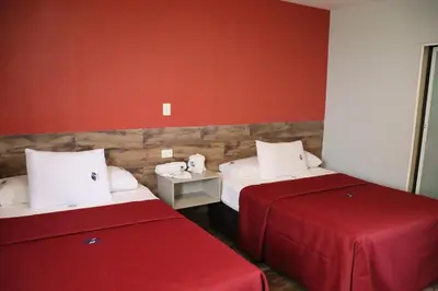 Cama o camas de una habitación en Hotel Teresita