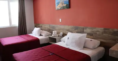 Cama o camas de una habitación en Hotel Teresita