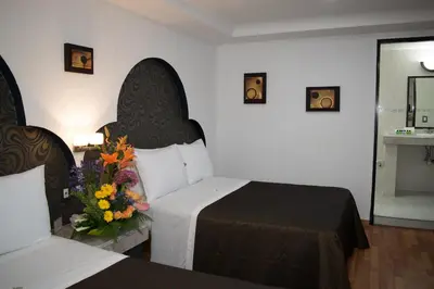 Cama o camas de una habitación en Hotel Santiago