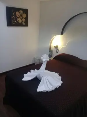 Cama o camas de una habitación en Hotel Santiago