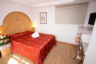 Cama o camas de una habitación en Hotel Santiago