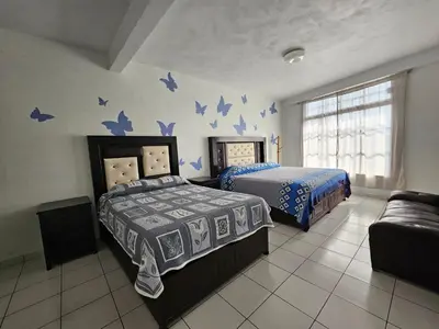 Cama o camas de una habitación en Hotel posada Juquila