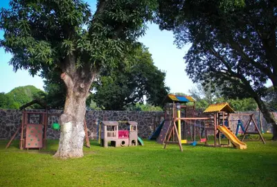 Zona de juegos infantil en MAJU HOTEL CAMPESTRE & SPA