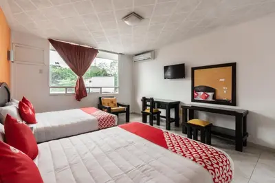 Cama o camas de una habitación en OYO Hotel Casa Blanca