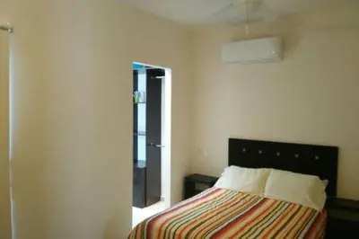 Cama o camas de una habitación en Casa con alberca y laguna