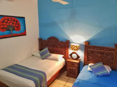 Cama o camas de una habitación en Casa de Huespedes Cielito Lindo