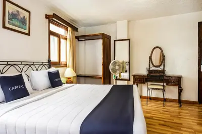 Cama o camas de una habitación en Capital O Hotel Central, Xalapa