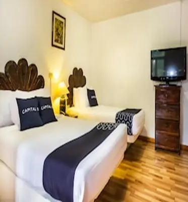 Cama o camas de una habitación en Capital O Hotel Central, Xalapa