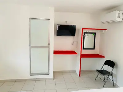 Una televisión o centro de entretenimiento en Hotel Maria Bonita Acapulco