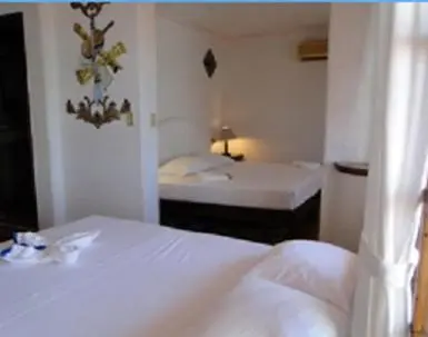 Cama o camas de una habitación en Hotel Paraiso Escondido