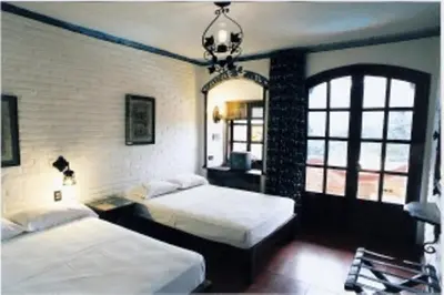 Cama o camas de una habitación en Hotel Paraiso Escondido