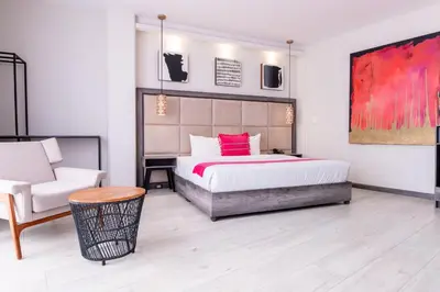 Cama o camas de una habitación en Arkana Puebla by Grupo Amber