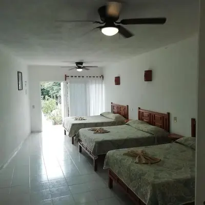 Cama o camas de una habitación en Hotel Quinta Paraiso