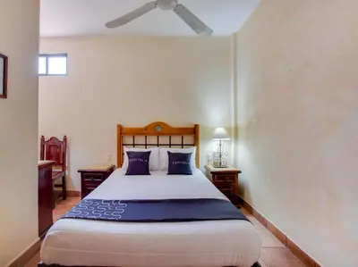 Cama o camas de una habitación en Hotel Valle De Oaxaca