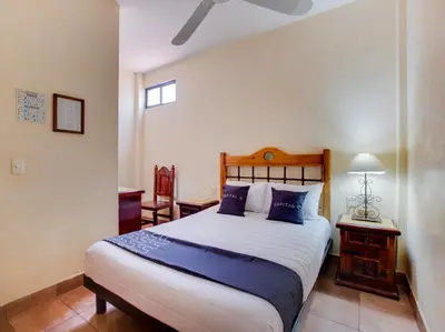 Cama o camas de una habitación en Hotel Valle De Oaxaca