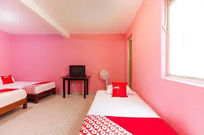 Cama o camas de una habitación en OYO Hotel Emperador, Oaxaca