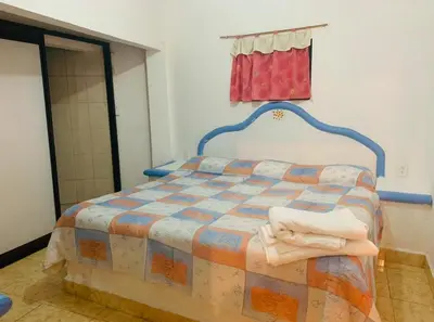 Cama o camas de una habitación en Hotel Puerto Villamar