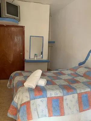 Cama o camas de una habitación en Hotel Puerto Villamar