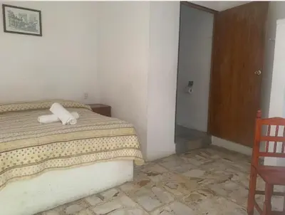 Cama o camas de una habitación en Hotel Puerto Villamar