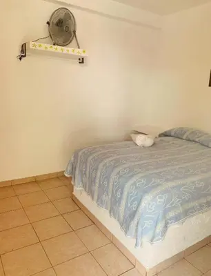 Cama o camas de una habitación en Hotel Puerto Villamar