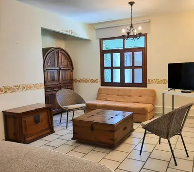 Una televisión o centro de entretenimiento en Casa los Cantaros Hotel Boutique