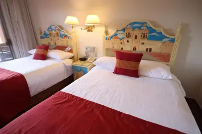 Cama o camas de una habitación en Hotel Hacienda Don Cenobio