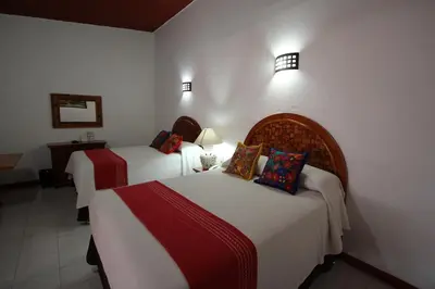 Cama o camas de una habitación en Hotel Anua Oaxaca