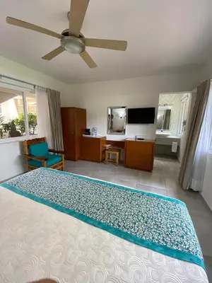 Una televisión o centro de entretenimiento en Hotel Posada Quinta Las Flores
