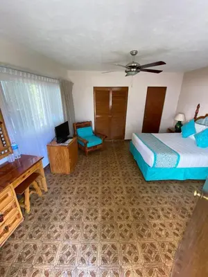 Cama o camas de una habitación en Hotel Posada Quinta Las Flores