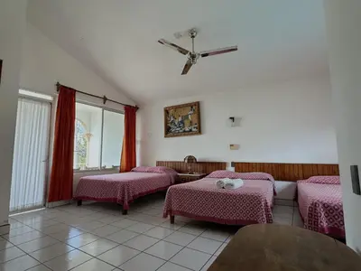 Cama o camas de una habitación en Hotel San Juan