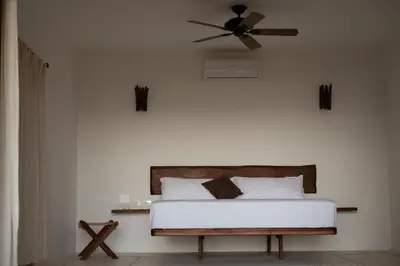 Cama o camas de una habitación en El Alquimista Yoga Spa