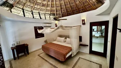 Cama o camas de una habitación en El Alquimista Yoga Spa