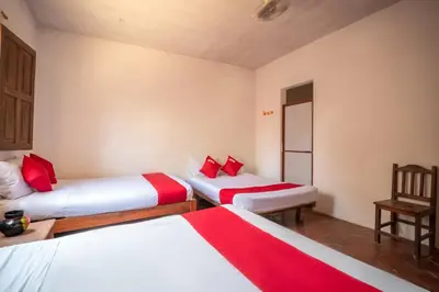 Cama o camas de una habitación en OYO Cabañas Abril, Mazunte