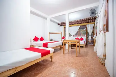 Cama o camas de una habitación en OYO Cabañas Abril, Mazunte