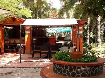 Jardín al aire libre en Villa Paraiso
