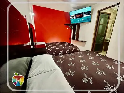 Cama o camas de una habitación en HOTEL LA GRAN MANZANA