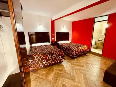Cama o camas de una habitación en HOTEL LA GRAN MANZANA