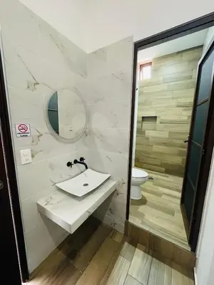 Un baño de HOTEL LA GRAN MANZANA