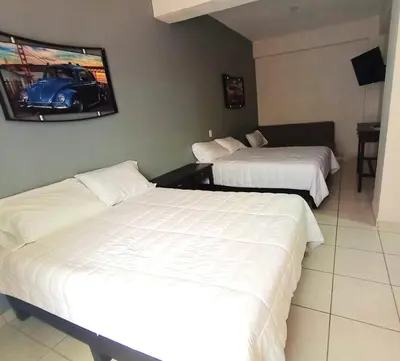 Cama o camas de una habitación en HOTEL BOUTIQUE ÁRBOL De LA VIDA