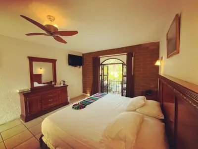 Cama o camas de una habitación en Hotel Hacienda Ventana del Cielo
