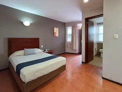 Cama o camas de una habitación en Hotel Panamerican