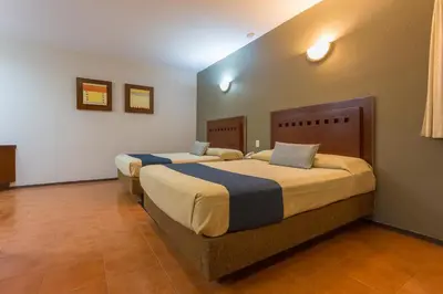 Cama o camas de una habitación en Hotel Panamerican
